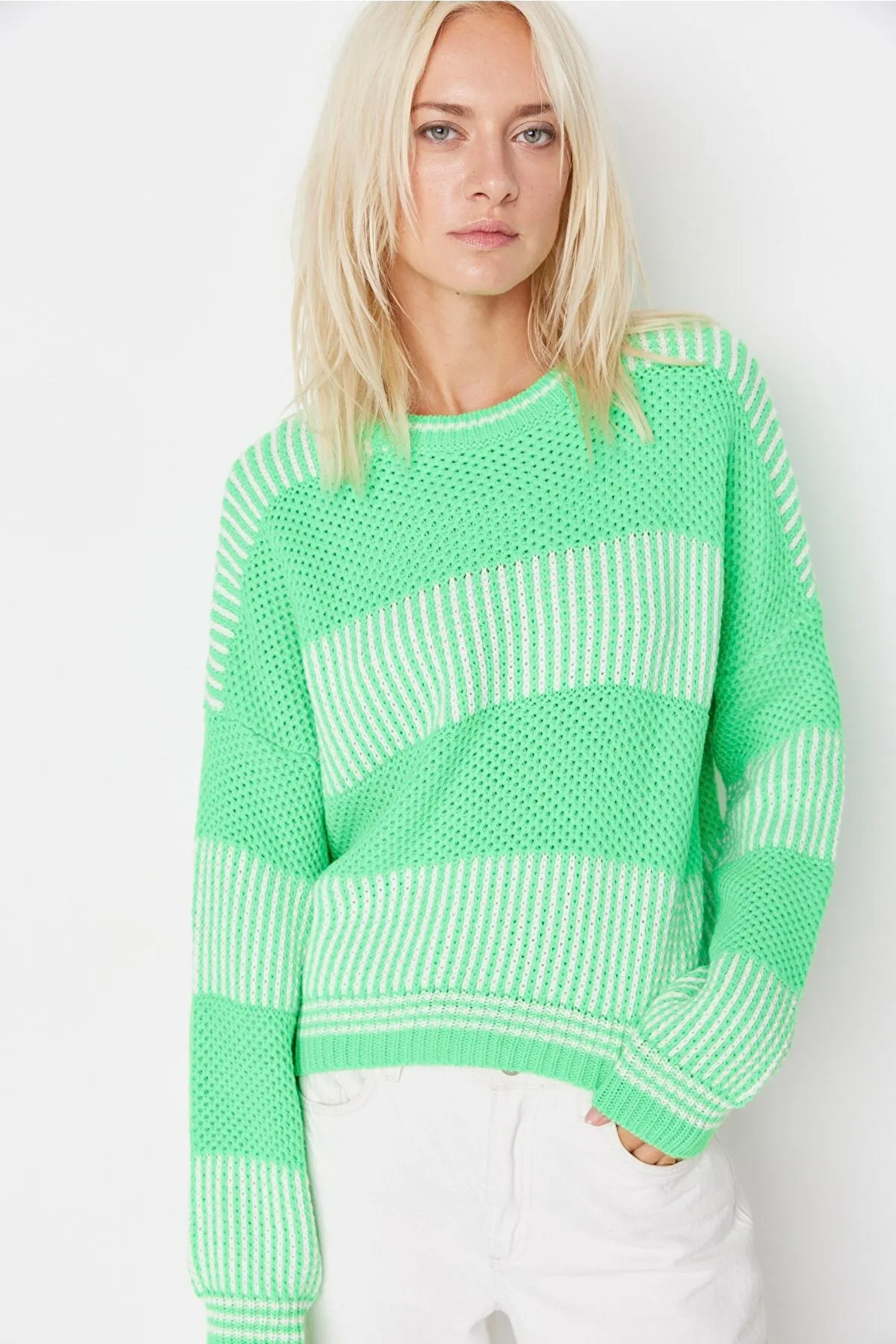 green knitted top